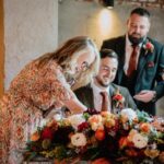 Bride and Groom sign their marriage paperwork with Stefanie Onipko Humanist Celebrant at the Wool Tower.